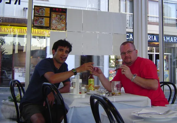 The two founders at a café table