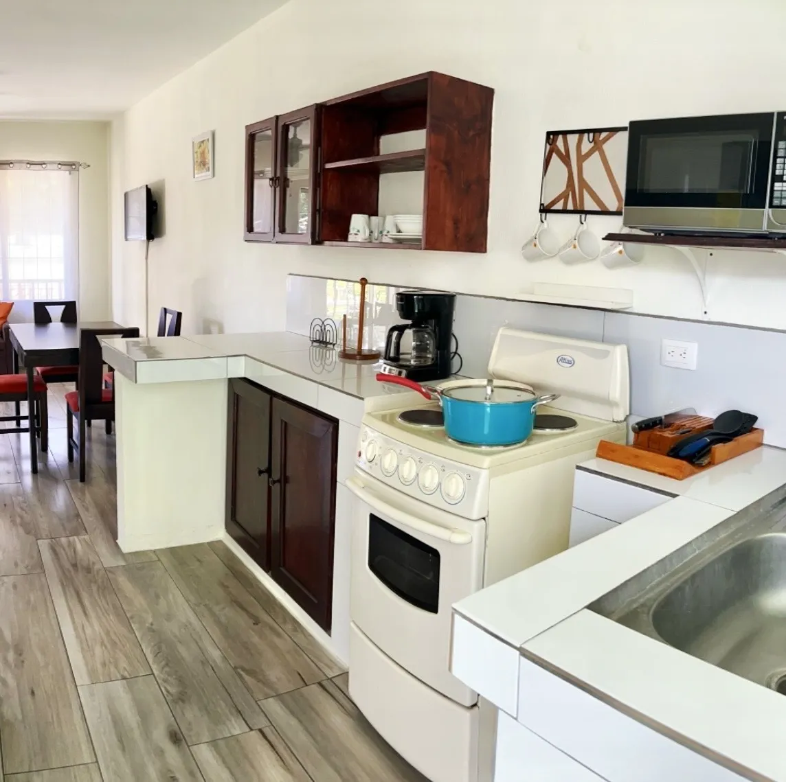 Kitchen with stove, microwave and coffee maker
